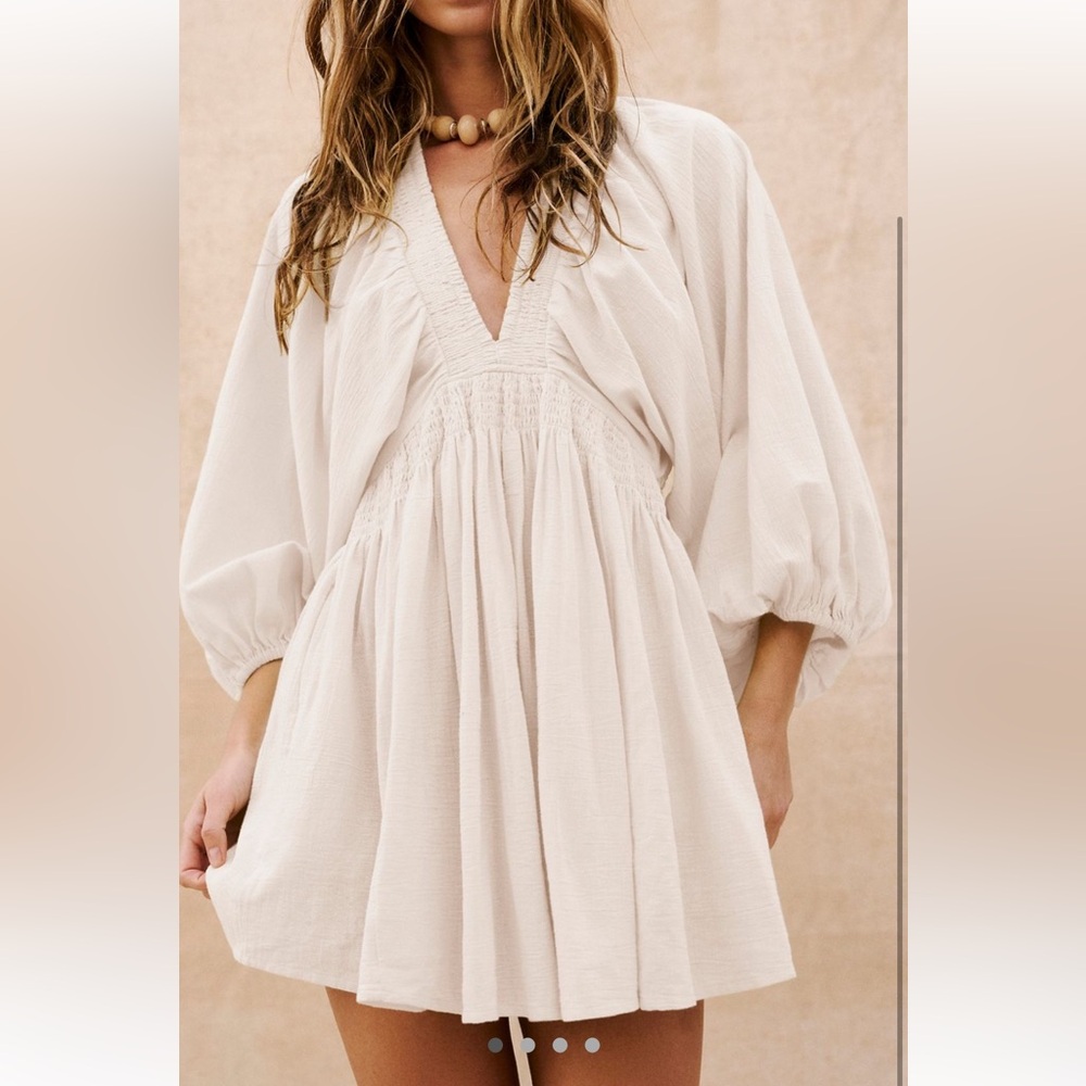 Free people mini dress in key lime color. Low cut, lightweight, bell sleeve